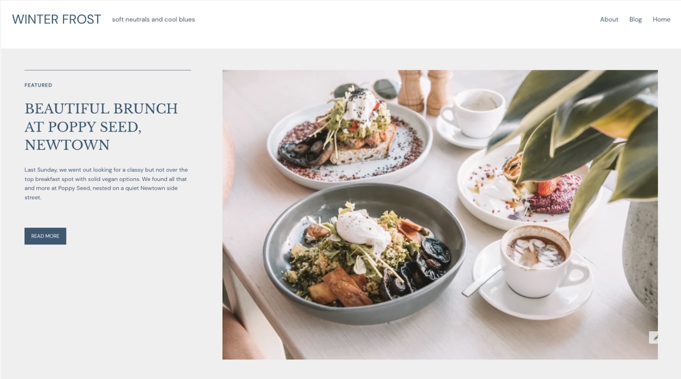 a screenshot of a website with a light blue and white color palatte and a picture of a brunch spread